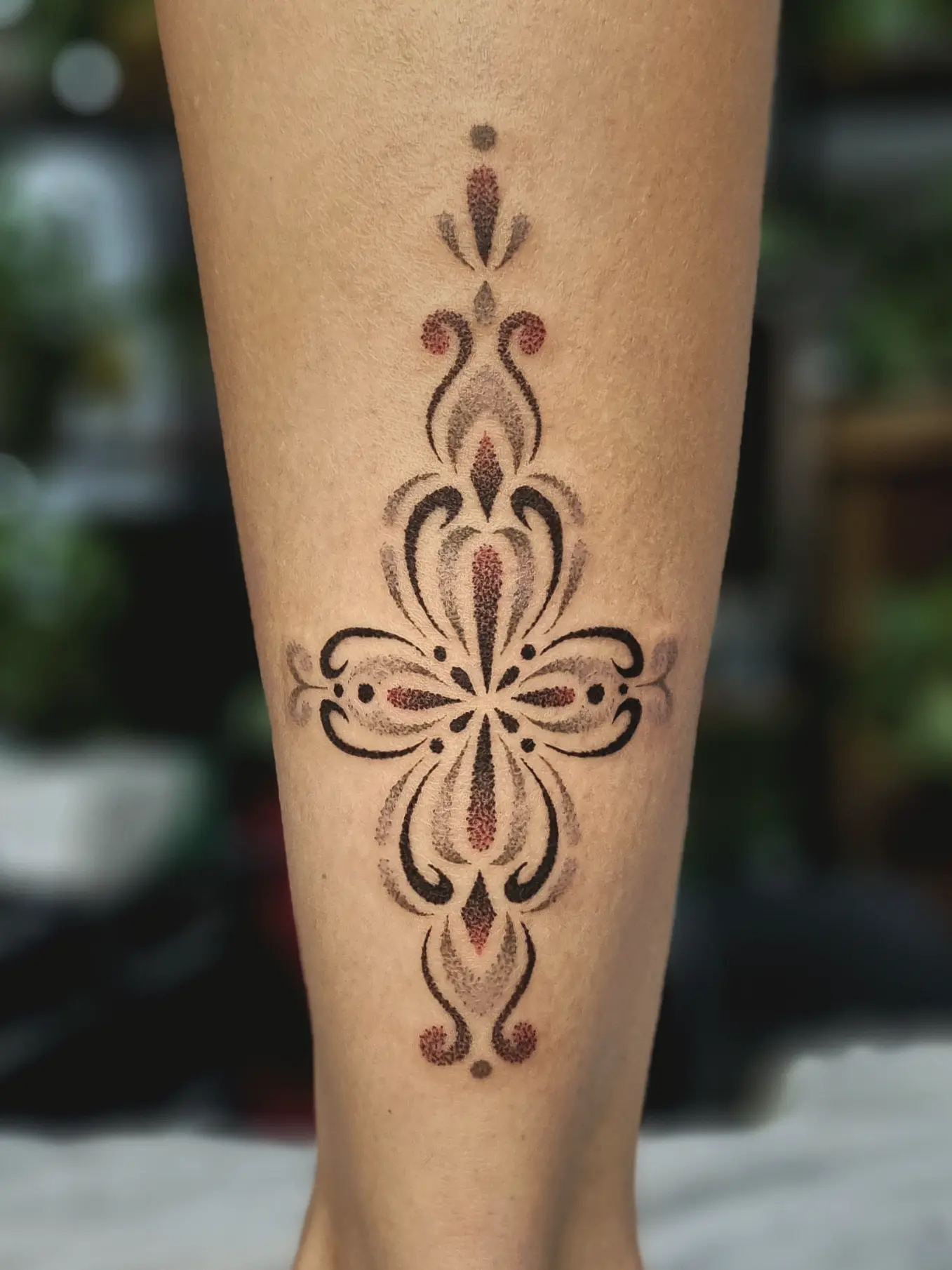lady bao colorful ornamental dotwork tattoo, back of leg